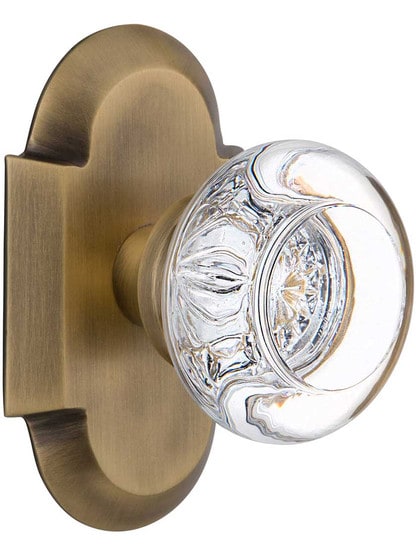 Arched Rosette Door Set with Round Clear-Crystal Glass Knobs in Antique Brass.